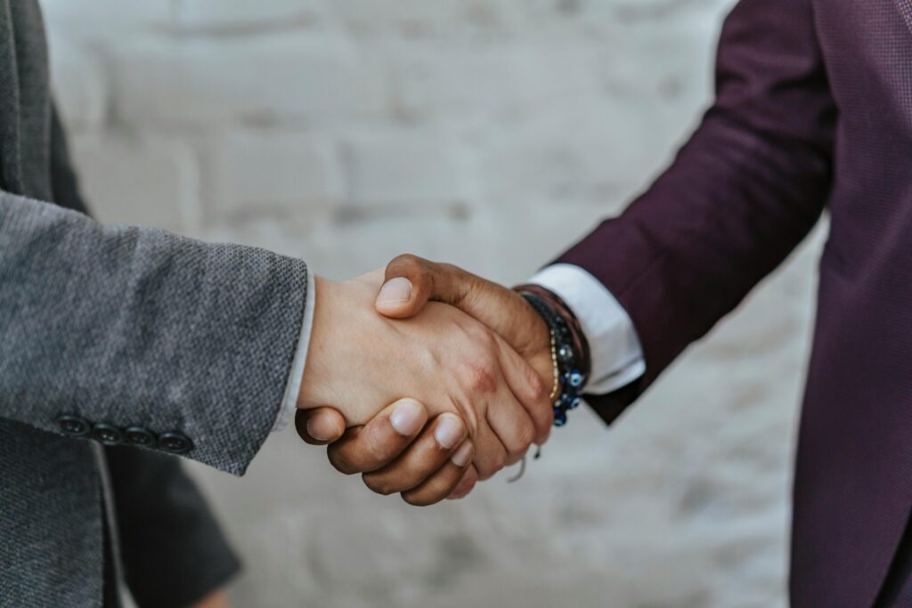 pexels photo 5313361 5313361 Professional handshake symbolizing cooperation and partnership in a business setting.